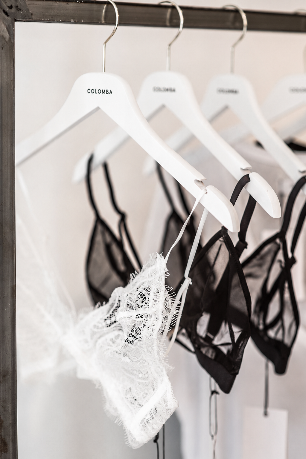 Ivory lace with ribbon on rumpled bed